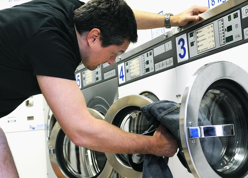 appliance expert doing washer dryer repair 